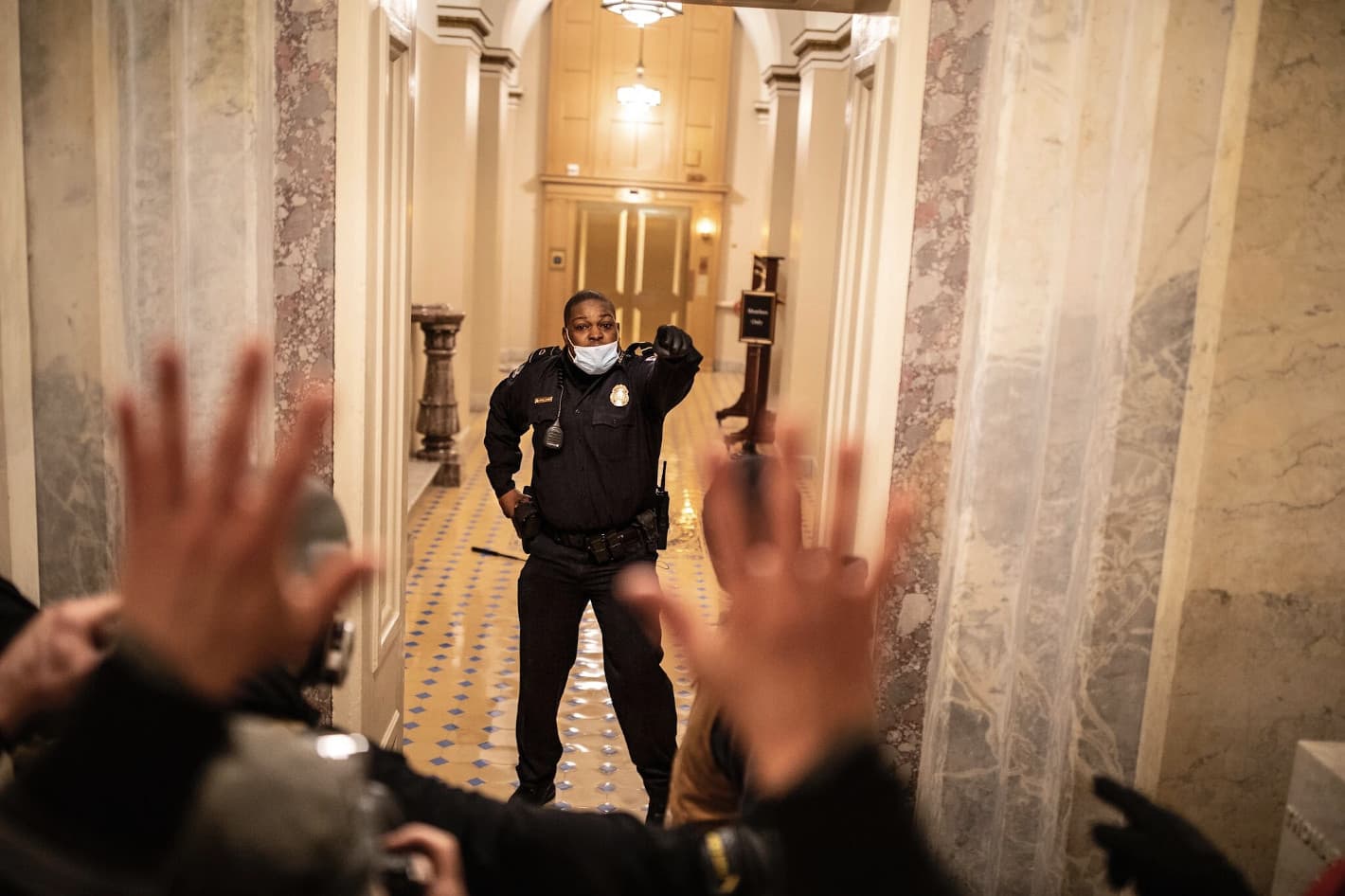 Officer Eugene Goodman facing down insurrectionists in the US Capitol invasion